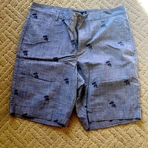 Men’s golf shorts. With palm trees on the shorts.